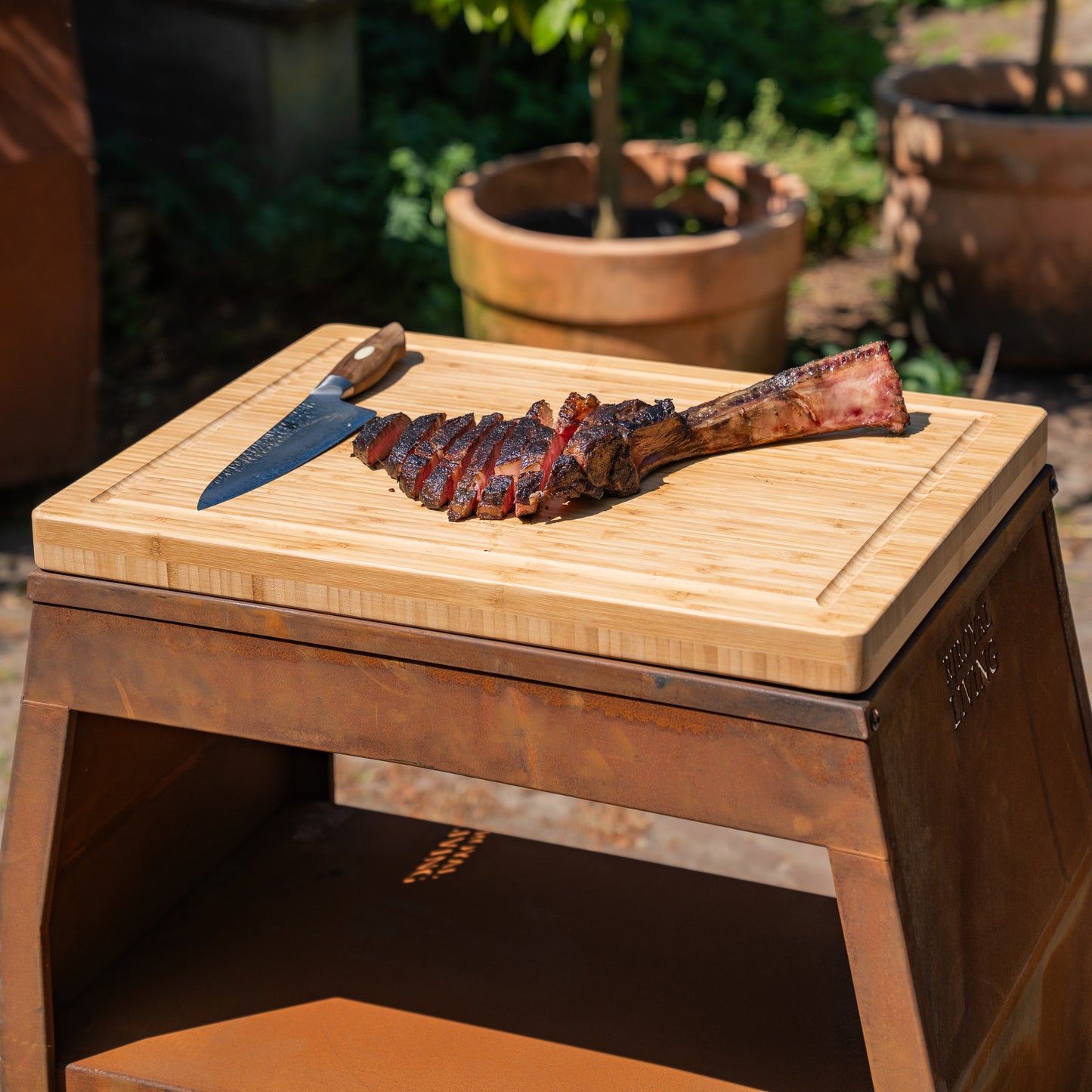 BBQ plancha table in corten steel with optional cutting board